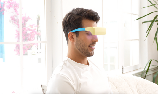 Man wearing a futuristic eyepatch with a blurred background
